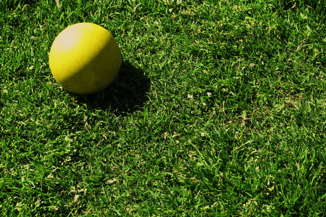 yellow lacrosse ball that can be used for sports massages