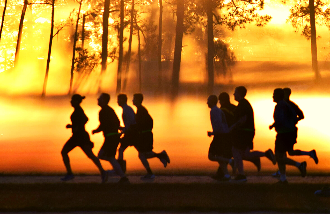 military members on a morning run for PT