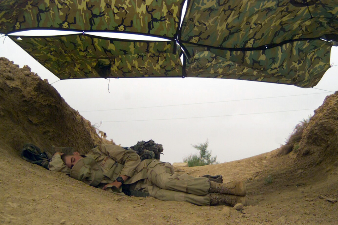 military member sleeping to prepare for training
